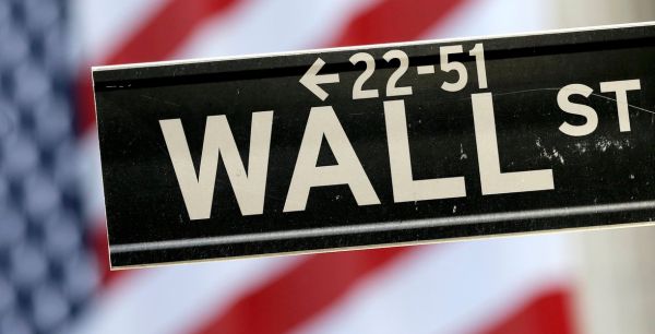 A Wall Street street sign is framed