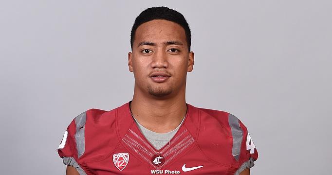 2015 Washington State University football players wearing jerseys on gray background