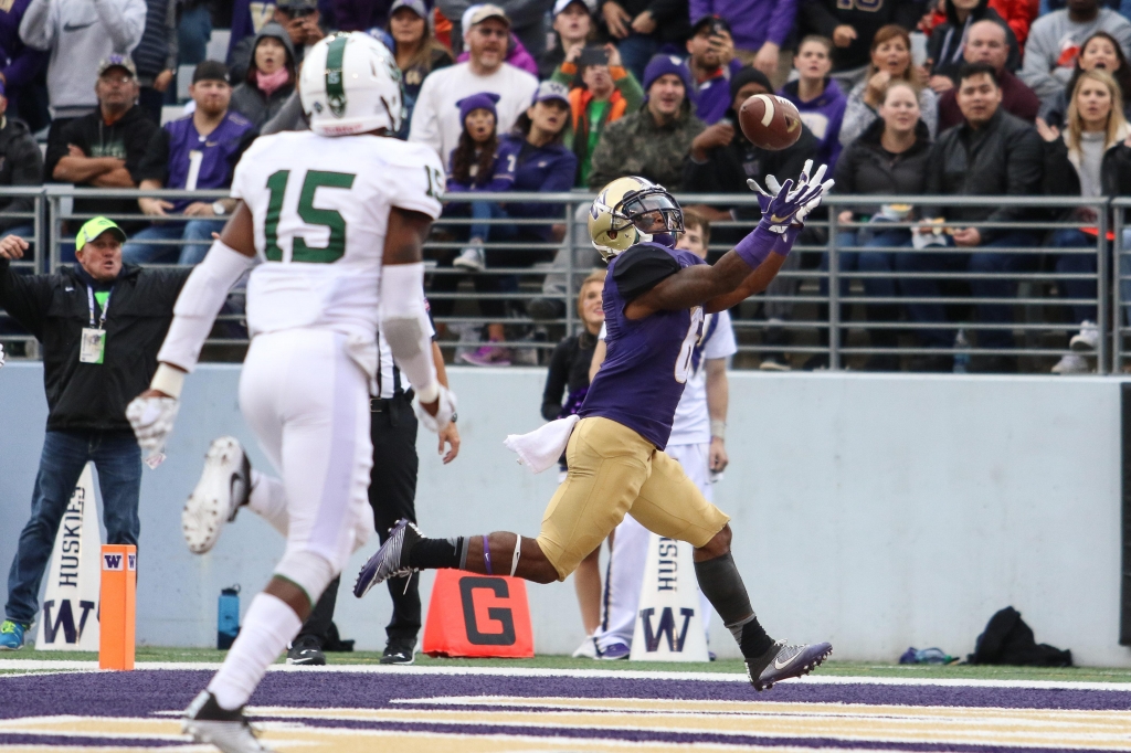 Washington’s Chico Mc Clatcher looks over his shoulder to catch a touchdown pass from Jake Browning and open the scoring