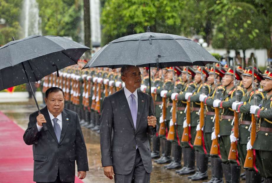 President Bounnhang Vorachit and President Obama inspect an honor guard in Vientiane