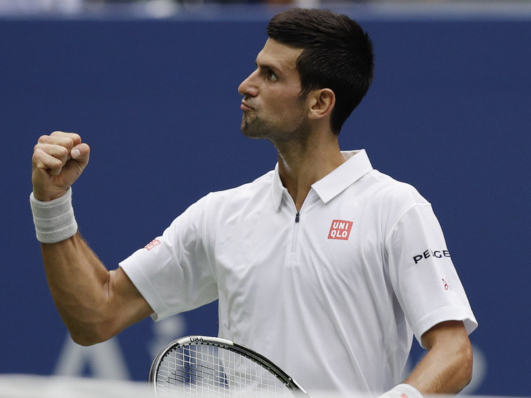 Novak Djokovic reacts after winning a game against Gael Monfils