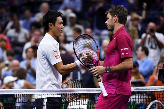 Wawrinka and Nishikori shake hands at the net after the match