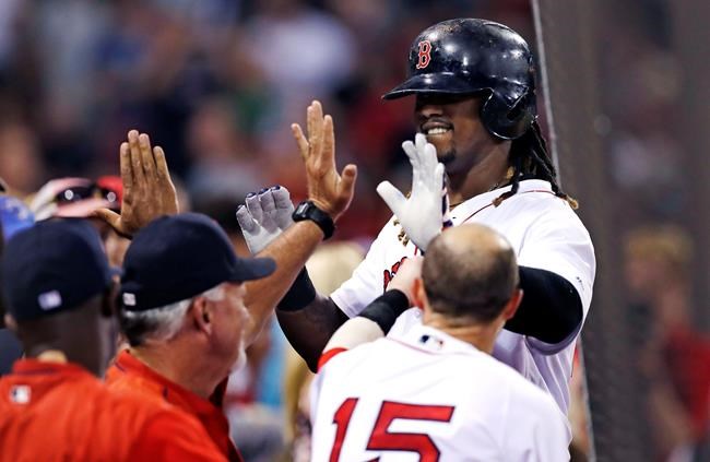 Boston Red Sox's Hanley Ramirez right is congratulated teammates his solo home run during the fifth inning of a baseball game against the Tampa Bay Rays at Fenway Park Tuesday Aug. 30 2016 in Boston