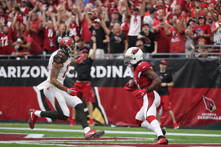 Cardinals cornerback Patrick Peterson returns an interception as intended target Mike Evans looks to make the tackle. Arizona forced five turnovers the Bucs forced none