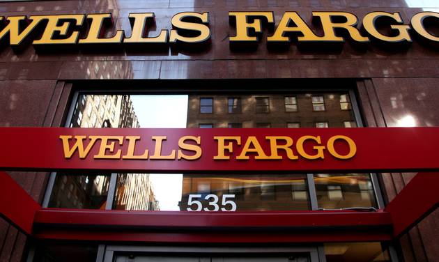 Wells Fargo sign is displayed at a branch in New York. Wells Fargo is in the spotlight after its employees allegedly created up to 2 million bank and credit card accounts transferred customers&#039 money without