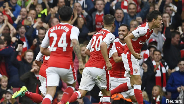 Arsenal's Laurent Koscielny celebrates scoring their first goal with team mates