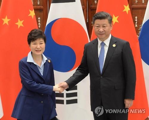 President Park Geun-hye shakes hands with her Chinese counterpart Xi Jinping before their talks on the sidelines of the summit of the Group of 20 leading economies in Hangzhou eastern China on Sept. 5 2016