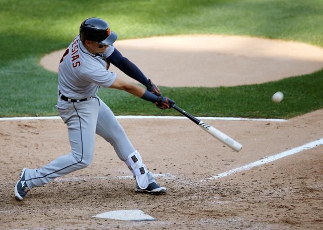 Detroit Tigers&#39 Jose Iglesias hits a ground-rule double off Chicago White Sox starting pitcher Jose Quintana scoring James McCann during the seventh inning of a baseball game Wednesday Sept. 7 2016 in Chicago