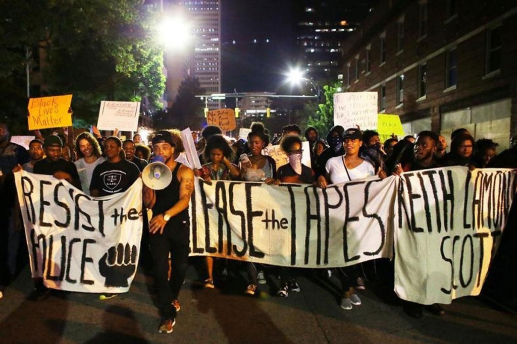 Protesters march during another night of protests over the police shooting of Keith Scott in Charlotte North Carolina