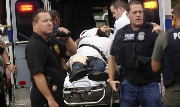 Ahmad Khan Rahami is taken into custody after a shootout with police in Linden N.J. Rahami a U.S. citizen born in Afghanistan has been charged by federal officials in two states with planting bombs in Ne