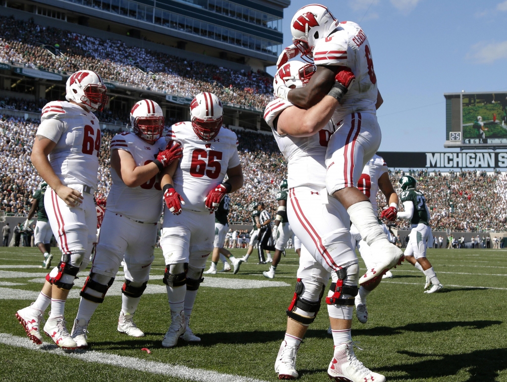 Wisconsin's Corey Clement right celebrates his touchdown against Michigan State with teammates