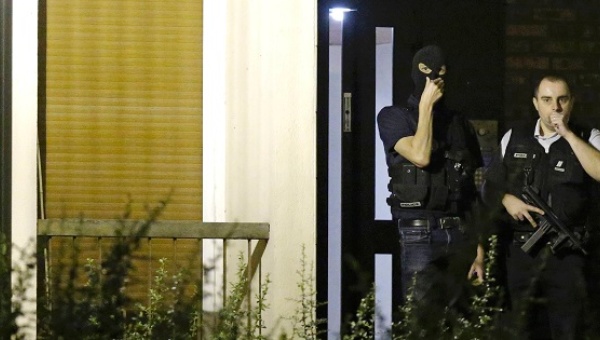 French police investigate an apartment in a residential building during a police raid in Boussy-Saint-Antoine near Paris France