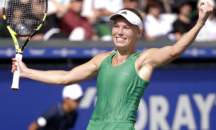 Caroline Wozniacki of Denmark celebrates after winning over Naomi Osaka of Japan during the final of the Pan Pacific Open tennis tournament in Tokyo Sunday Sept. 25