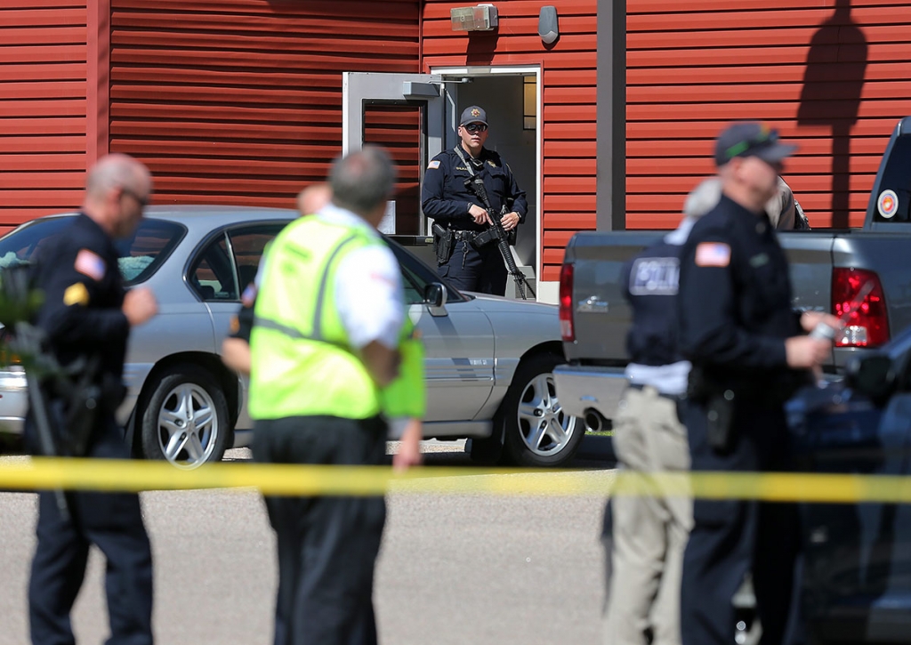 A Cheyenne Police officer guards an entrance to Heritage Court Apartments Wednesday Sept. 14 2016 in northeast Cheyenne Wyo