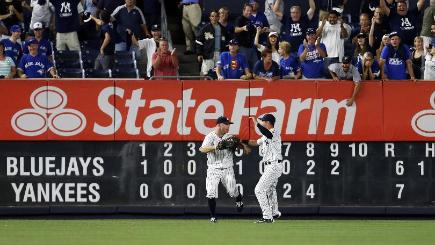 Brett Gardner left celebrates making the game-ending catch