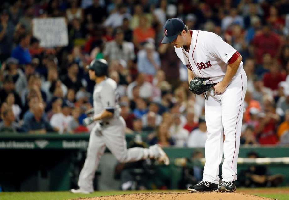 Boston Red Sox's Drew Pomeranz stands on the mound after giving up a solo home run to New York Yankees Gary Sanchez left during the third inning of a baseball game in Boston Sunday Sept. 18 2016. ORG XMIT MAMD106