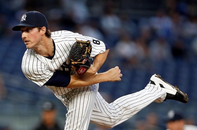 New York Yankees starting pitcher Bryan Mitchell watches a pitch during the first inning of a baseball game against the Toronto Blue Jays on Wednesday Sept. 7 2016 in New York. The Yankees won 2-0