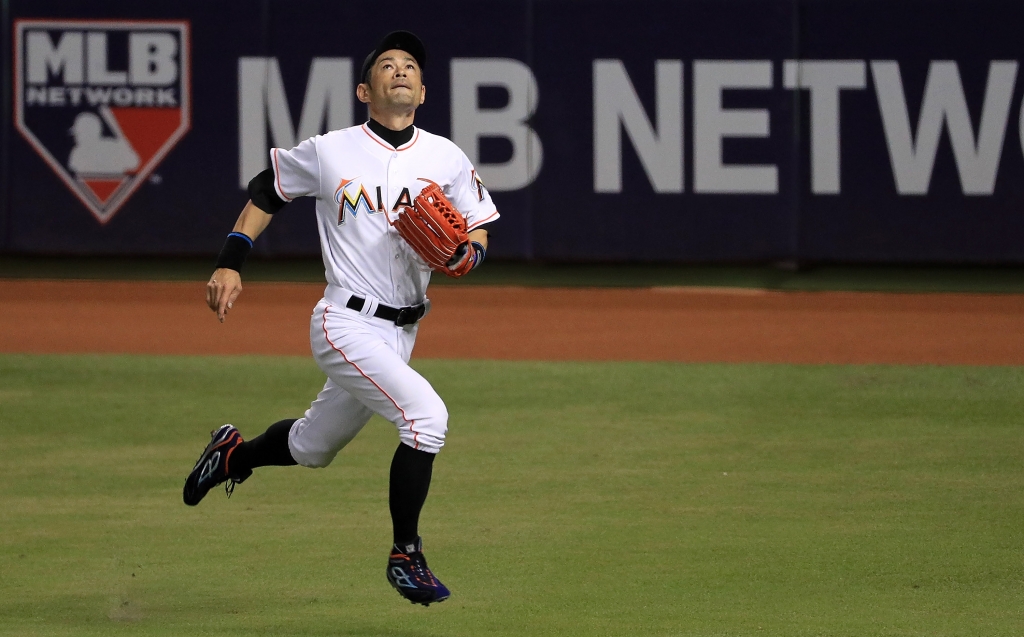 Ichiro Suzuki #51 of the Miami Marlins chases a foul ball during a game against the Washington Nationals at Marlins Park