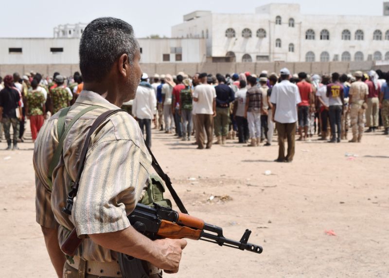 Yemeni men loyal to exiled President Abedrabbo Mansour Hadi take part in military training