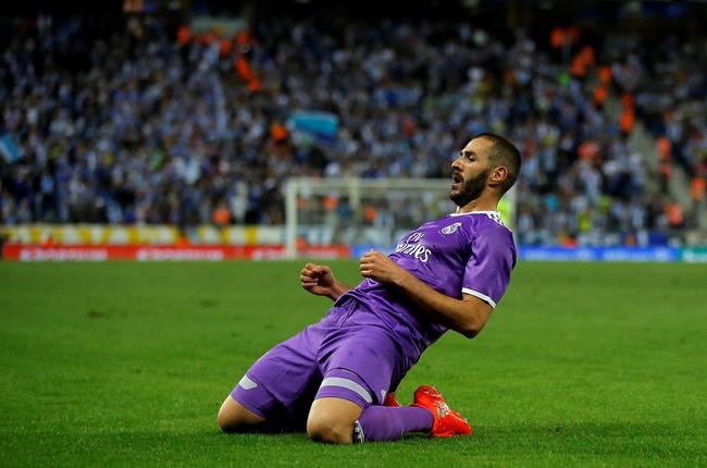 Real Madrid's Karim Benzema reacts after scoring during the Spanish La Liga soccer match between Espanyol and Real Madrid at RCDE stadium in Cornella Llobregat Spain Sunday Sept. 18 2016