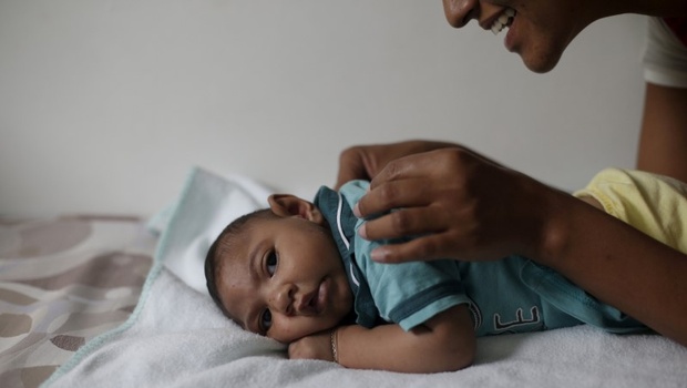 Mariam Araujo 25 plays with Lucas her 4-months old second child and born with microcephaly as they wait for a physiotherapy session in Pedro I hospital in Campina Grande Brazil