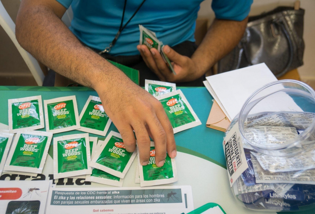 Condoms bug repellent wipes and literature on the prevention of ZIka and other diseases handed out by health clinic workers during a wellness fair in the Las Cuevas neighborhood on Aug. 31 2016 in Loiza Puerto Rico