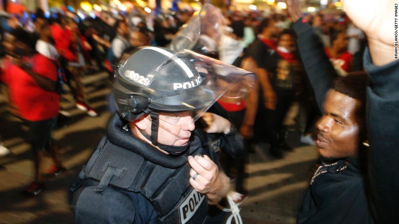 Protesters in Charlotte police shooting injure officers, shut highway