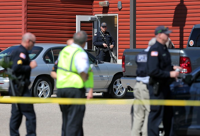 The Latest: Gunman Shoots 3 at a Complex Before Killing Self