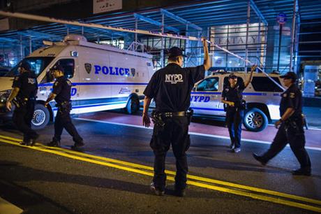 Police arrive on the scene of an explosion in Manhattan's Chelsea neighborhood in New York Saturday Sept. 17 2016. A law enforcement official tells The Associated Press that an explosion in the Chelsea neighborhood appears to have come from a con