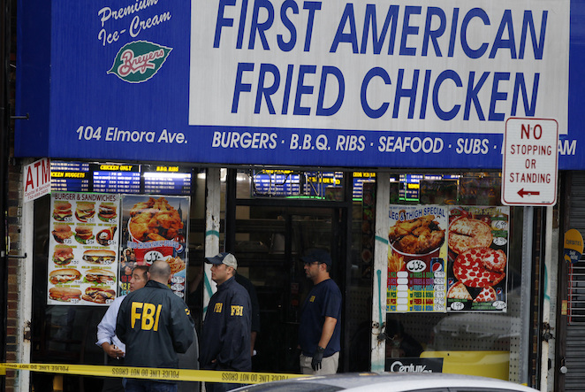 FBI agents walk around the roof outside an apartment during an investigation at a building Monday Sept. 19 2016 in Elizabeth N.J. FBI agents are searching the apartment that is tied to Ahmad Khan Rahami wanted for questioning in the New York City bom