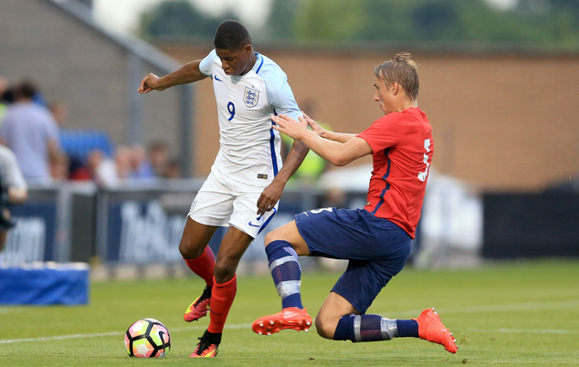 England's Marcus Rashford left and Norway's Ulrik Jenssen battle for the ball during the Under 21 Euro 2017 qualifying soccer match at the Community Stadiu