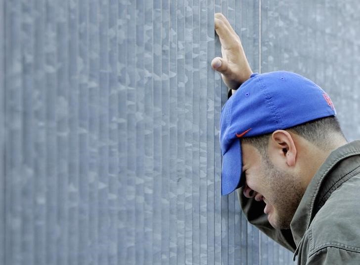 A man grieves outside the World Trade Center site in New York