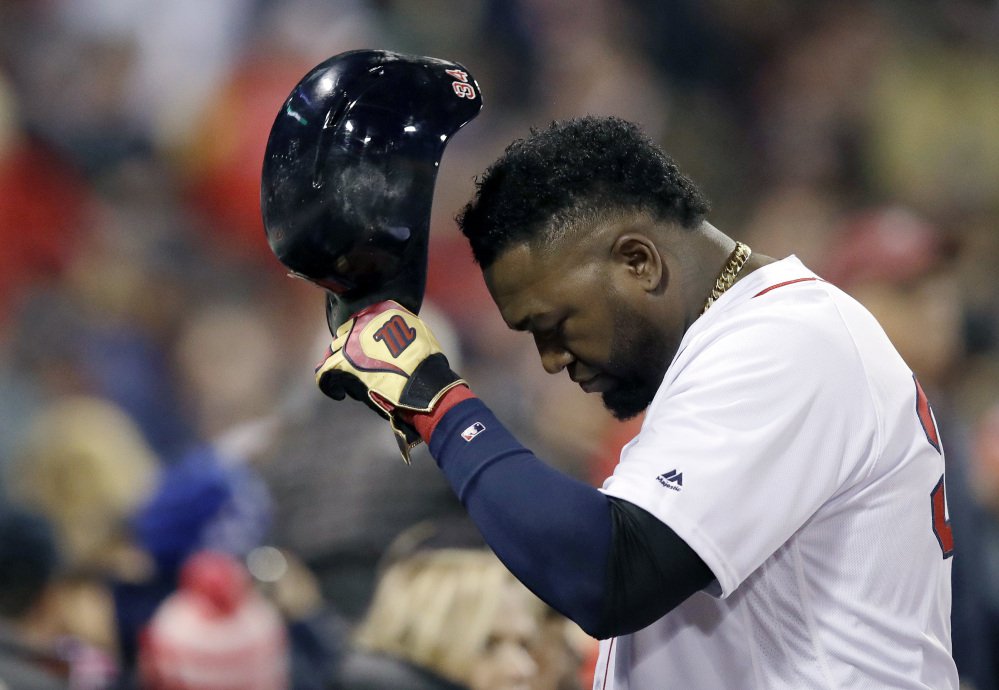 Red Sox designated hitter David Ortiz returns to the dugout after grounding out during the fourth inning in Game 3 of their American League Division Series against the Cleveland Indians on Monday in Boston