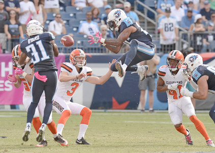 Tennessee Titans Rashad Johnson center and Kevin Byard try to control an onside kick by Cleveland Browns kicker Cody Parkey in the second half of an NFL football game Sunday Oct. 16 2016 in Nashville Tenn. The Browns recovered the ball