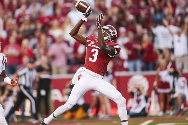 Chris Brashers  Associated Press Arkansas wide receiver Dominique Reed catches a touchdown during the second quarter