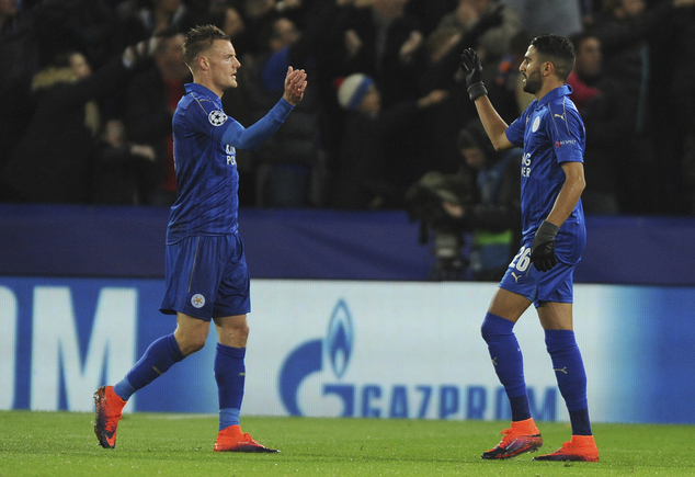 Leicester's Riyad Mahrez right celebrates with Leicester's Jamie Vardy after scoring a goal during the Champions League Group G soccer match between Leices