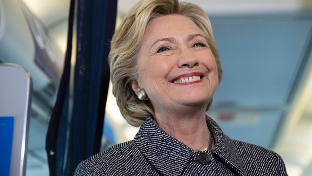 Democratic presidential candidate Hillary Clinton speaks with members of the media on her campaign plane at Chicago Midway Airport in Chicago Thursday Sept. 29 2016