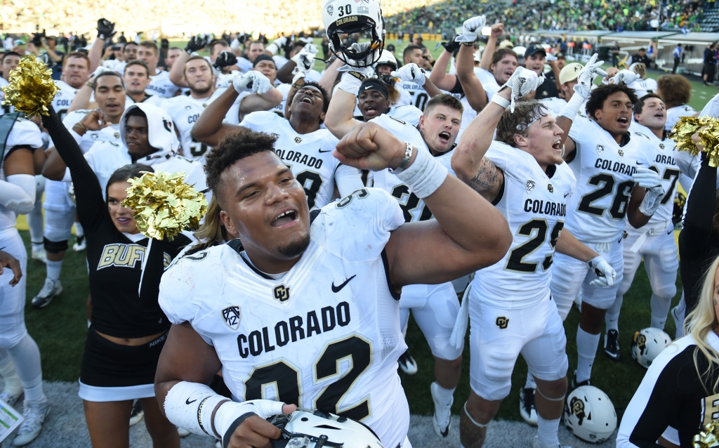 Defensive end Jordan Carrell #92 of the Colorado Buffaloes celebrates with his teammates after the game against the Oregon Ducks at Autzen Stadium