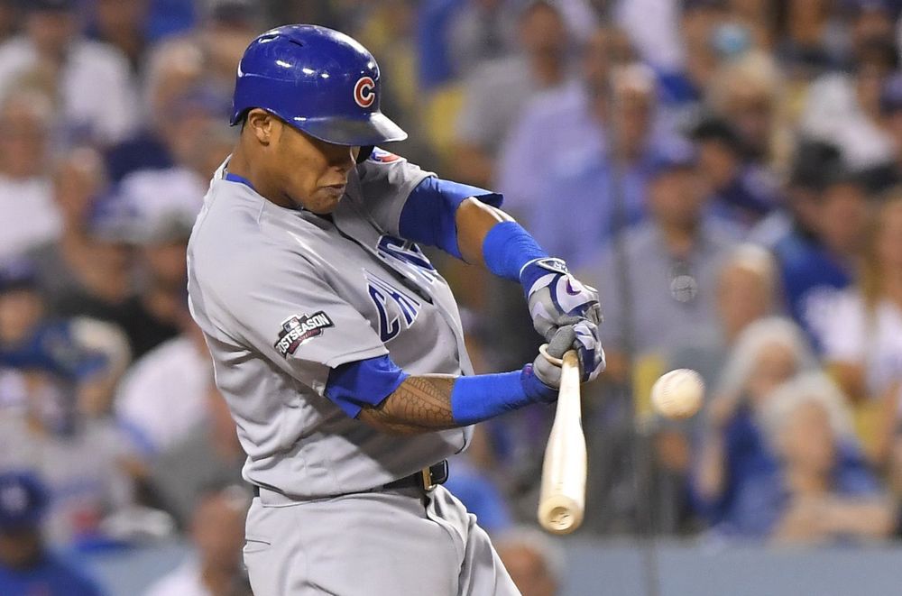 Chicago Cubs Addison Russell hits a two-run home run off Los Angeles Dodgers relief pitcher Joe Blanton during the sixth inning of Game 5 of the National League baseball championship series Thursday Oct. 20 2016 in Los Angeles. (AP