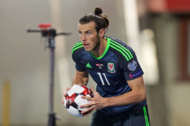 David Rawcliffe  Propaganda

Gareth Bale takes a long throw-in against Austria