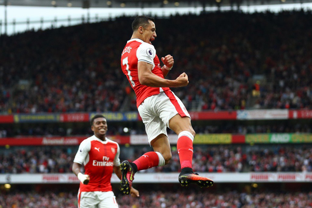 LONDON ENGLAND- SEPTEMBER 24 Alexis Sanchez of Arsenal celebrates scoring his sides first goal during the Premier League match between Arsenal and Chelsea at the Emirates Stadium