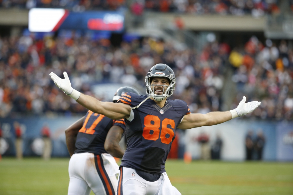 Chicago Bears tight end Zach Miller celebrates a touchdown during the second half of an NFL football game against the Detroit Lions Sunday Oct. 2 2016 in Chicago. At right is Chicago Bears wide receiver Alshon Jeffery