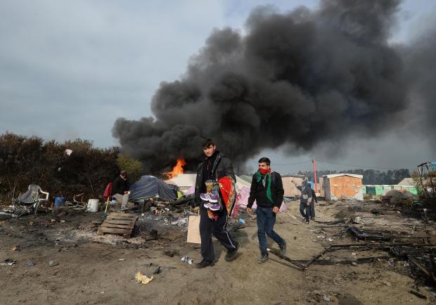 Crews Begin Dismantling the Calais 'Jungle' Migrant Camp