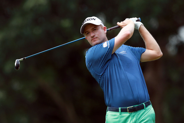 Russell Knox of Scotland plays a shot during day two of the 2016 CIMB Classic