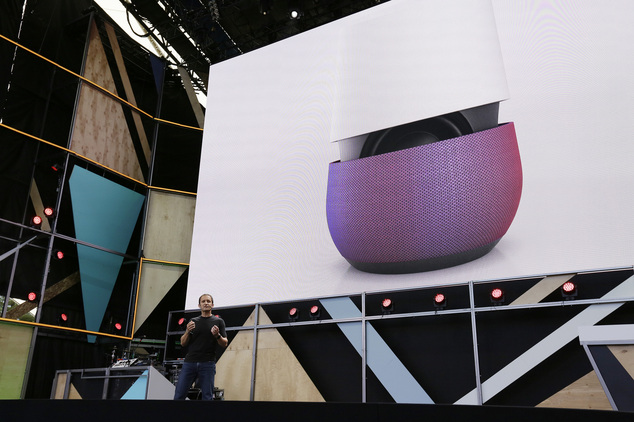 Google vice president Mario Queiroz gestures while introducing the new Google Home device during the keynote address