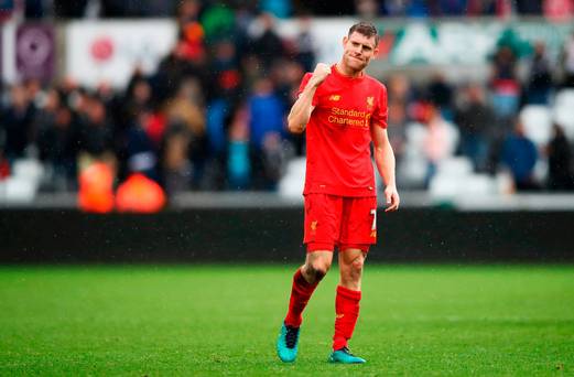 James Milner of Liverpool reacts to his sides win after the final whistle during the Premier League match between Swansea City and Liverpool at Liberty Stadium