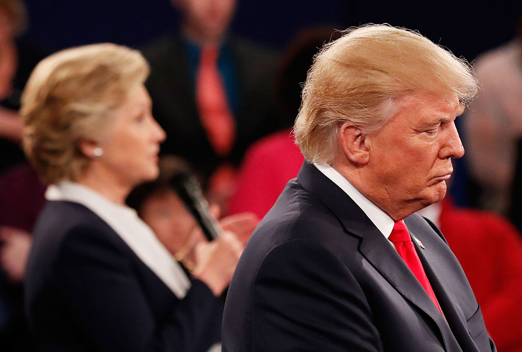 Hillary Clinton speaks as Donald Trump listens during the town hall debate at Washington University in St. Louis