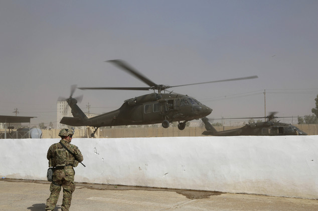 A helicopter belonging to the international coalition forces takes off from a base outside Mosul Iraq Wednesday Oct. 19 2016. The U.S. has just as much