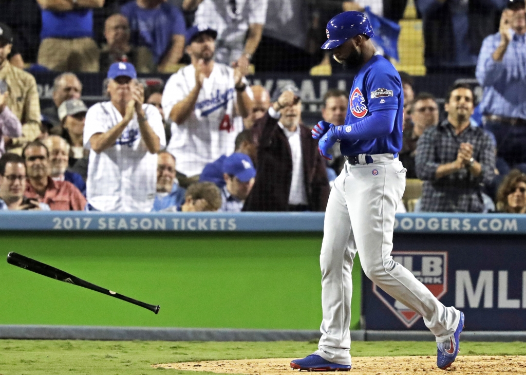 Jason Heyward tosses his bat after striking out in the seventh