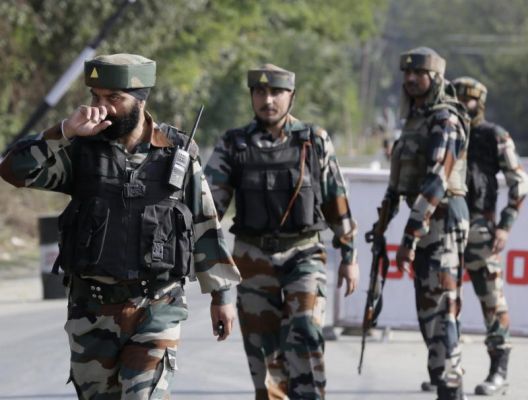 Indian army soldiers guard outside the base camp